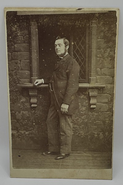 CDV: CDV: Man Standing by a Leaded Window on a Stone Wall. Stuart Brothers, London.: catalogue image 1