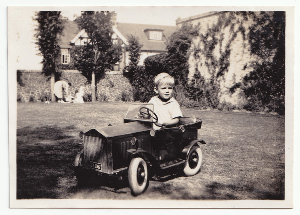 Photograph: Vintage Photograph – Young Child Playing in Model Pedal Car or Similar: catalogue image 1