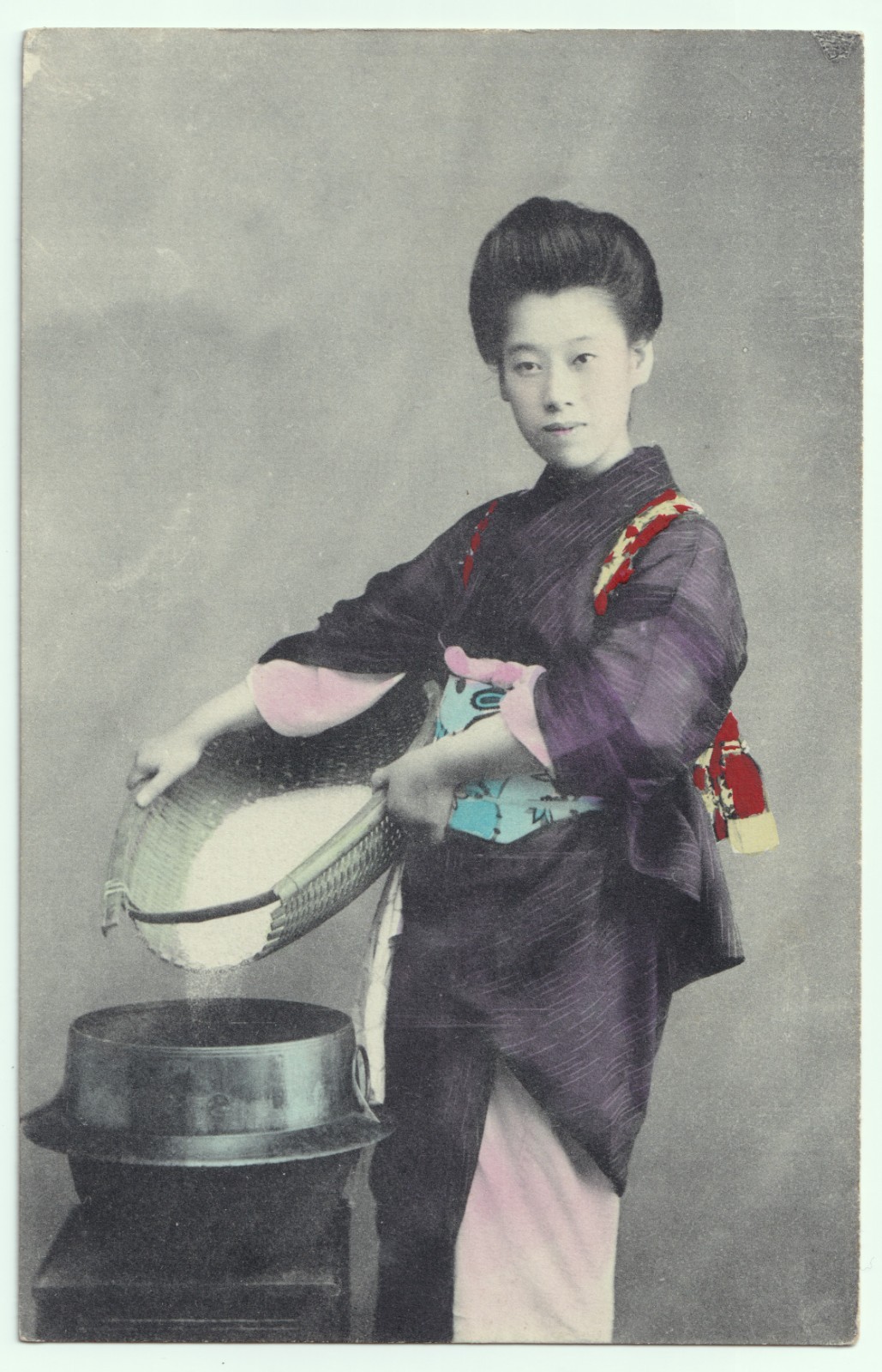 Postcard: Postcard, Japanese Female Sifting Rice from Basket. Hand Tinted.: catalogue image 1