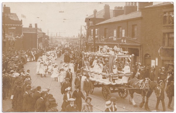 Postcard: Postcard, Unidentified Busy Procession Through Street. Real Photograph.: catalogue image 1